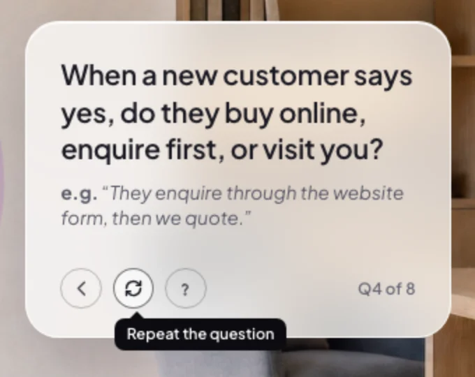 The question box close up, a question with its example and the pointer on the middle round button, its black label reading Repeat the question; the button and its label are outlined.