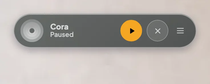 The pill paused, greyed out with its status reading Paused and the pause button orange; the Pause Cora button is outlined.