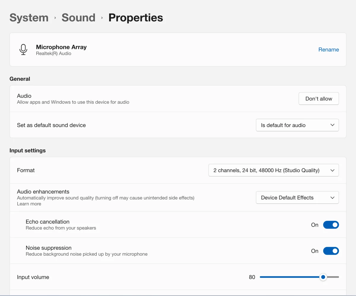 A drawn picture of Windows 11 Settings at System, Sound, Properties for the laptop's Microphone Array: Audio enhancements on Device Default Effects, with Echo cancellation and Noise suppression switched on below it; an arrow points to the outlined Noise suppression switch.